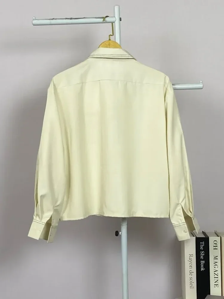 ASAYA Atasan lengan panjang polos dengan kerah polo, dilengkapi saku dan desain jahitan sambungan