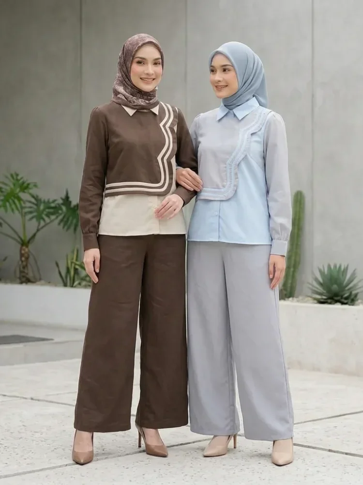 ASAYA Atasan lengan panjang desain braun memiliki efek dua lapis, dipadukan dengan rompi warna kontras dan celana panjang senada, lalu ditumpuk dengan celana panjang setelan tambahan.