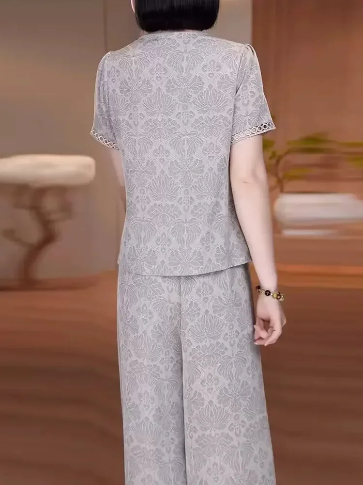 FADFAD Setelan dua potong bermotif atasan potongan kancing asimetris v-neck dan celana panjang lebar