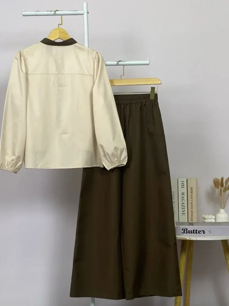 ASAYA Kemeja lengan panjang wanita dengan warna polos dan bawah yang tidak beraturan, dipadukan dengan desain tali kontras dan kancing tangan, kerah warna kontras dipadukan dengan celana panjang polos