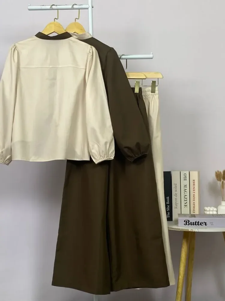 ASAYA Kemeja lengan panjang wanita dengan warna polos dan bawah yang tidak beraturan, dipadukan dengan desain tali kontras dan kancing tangan, kerah warna kontras dipadukan dengan celana panjang polos