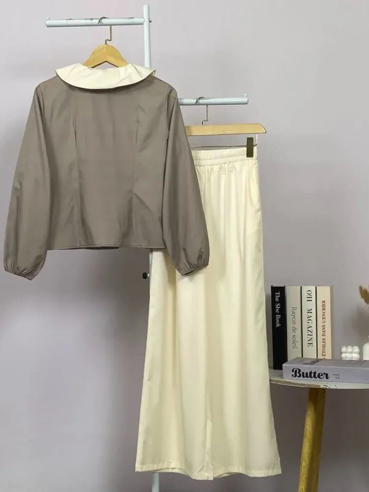 ASAYA Atasan lengan panjang warna polos dengan desain tidak beraturan dan kancing buatan tangan, dipadukan dengan celana panjang polos