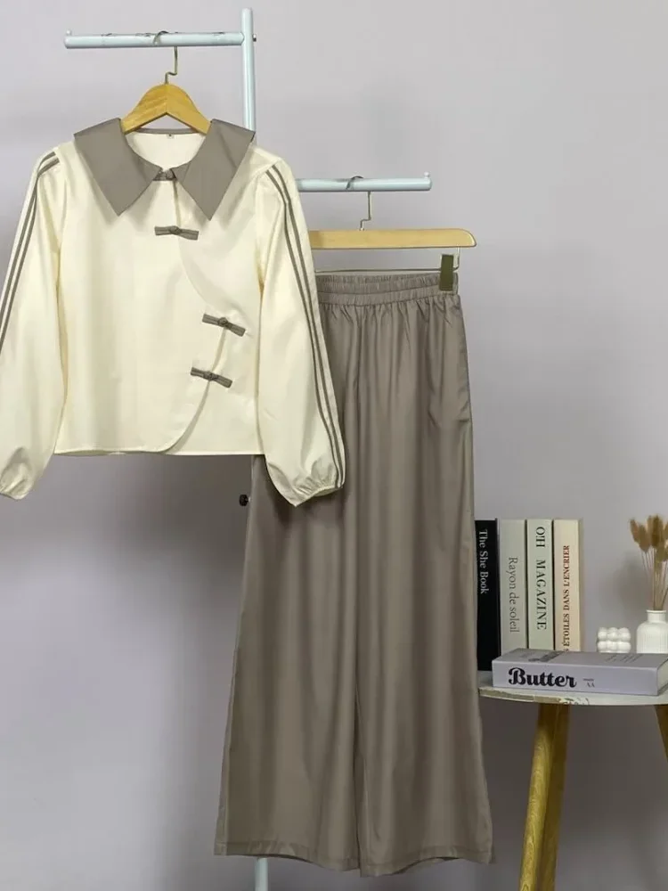 ASAYA Atasan lengan panjang warna polos dengan desain tidak beraturan dan kancing buatan tangan, dipadukan dengan celana panjang polos