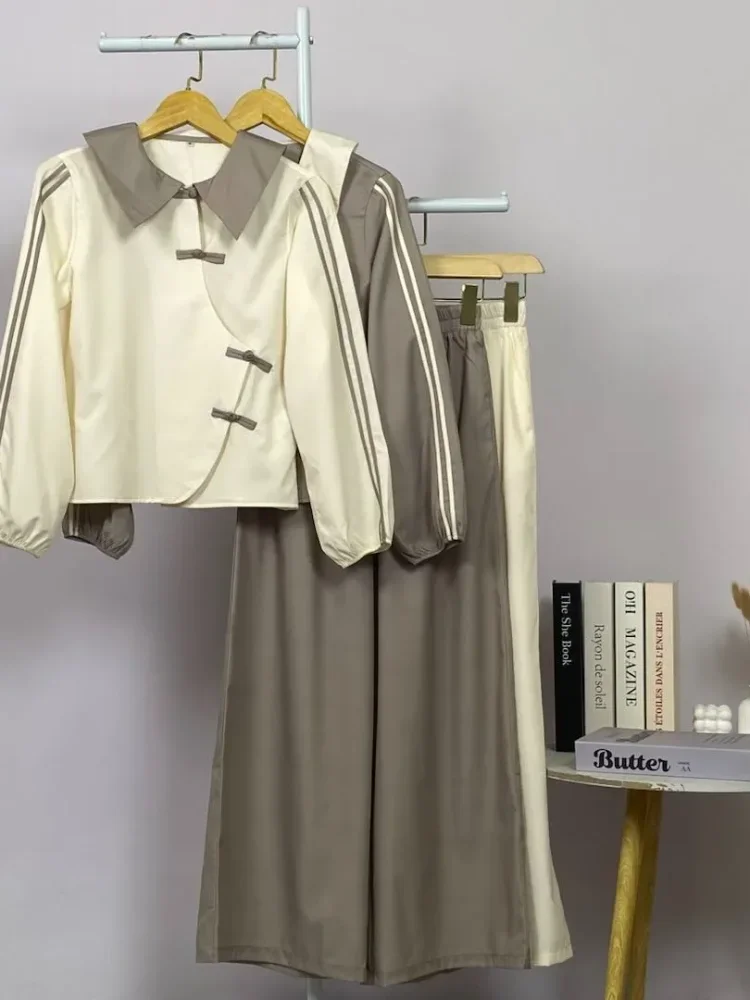 ASAYA Atasan lengan panjang warna polos dengan desain tidak beraturan dan kancing buatan tangan, dipadukan dengan celana panjang polos
