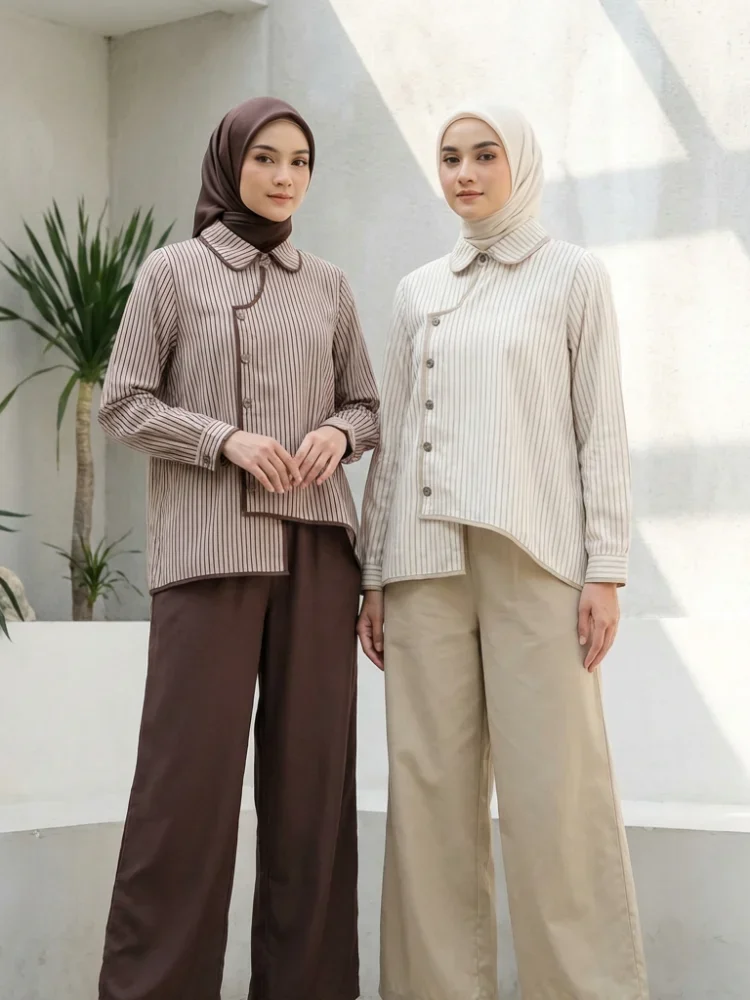 ASAYA Setelan dua potong: kemeja lengan panjang dengan desain kancing unik di bagian bawah dan kerah, dipadukan dengan celana panjang lebar polos