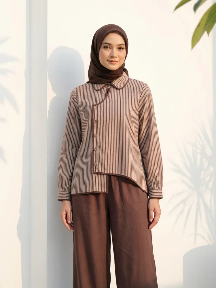 ASAYA Setelan dua potong: kemeja lengan panjang dengan desain kancing unik di bagian bawah dan kerah, dipadukan dengan celana panjang lebar polos