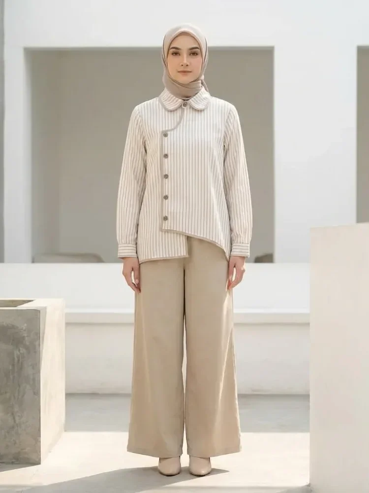 ASAYA Setelan dua potong: kemeja lengan panjang dengan desain kancing unik di bagian bawah dan kerah, dipadukan dengan celana panjang lebar polos