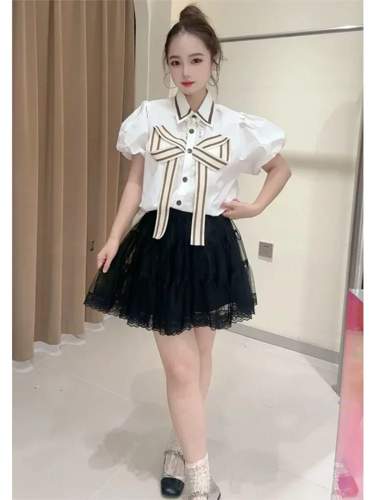 [DISKON KILAT]CHICMORE Atasan dengan pita cantik dan kancing unik sebaris lengan puff pendek untuk wanita