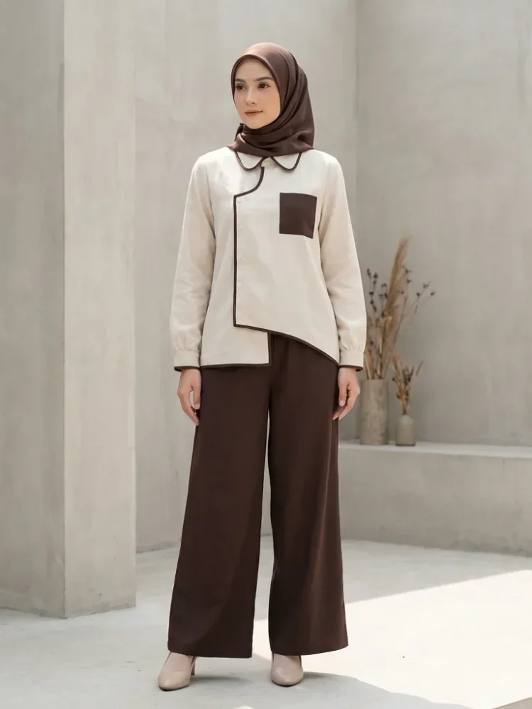 ASAYA Atasan lengan panjang warna kontras dengan kantong dan desain tepi tidak beraturan dipadukan dengan celana panjang longgar berwarna polos