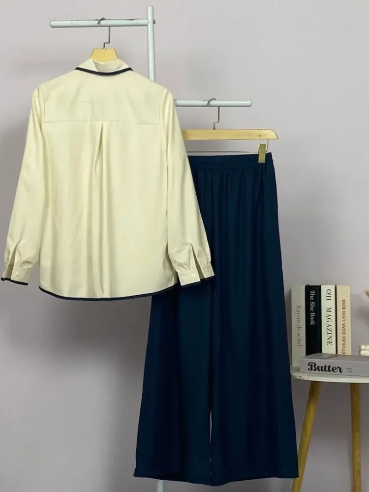 ASAYA Atasan lengan panjang warna kontras dengan kantong dan desain tepi tidak beraturan dipadukan dengan celana panjang longgar berwarna polos