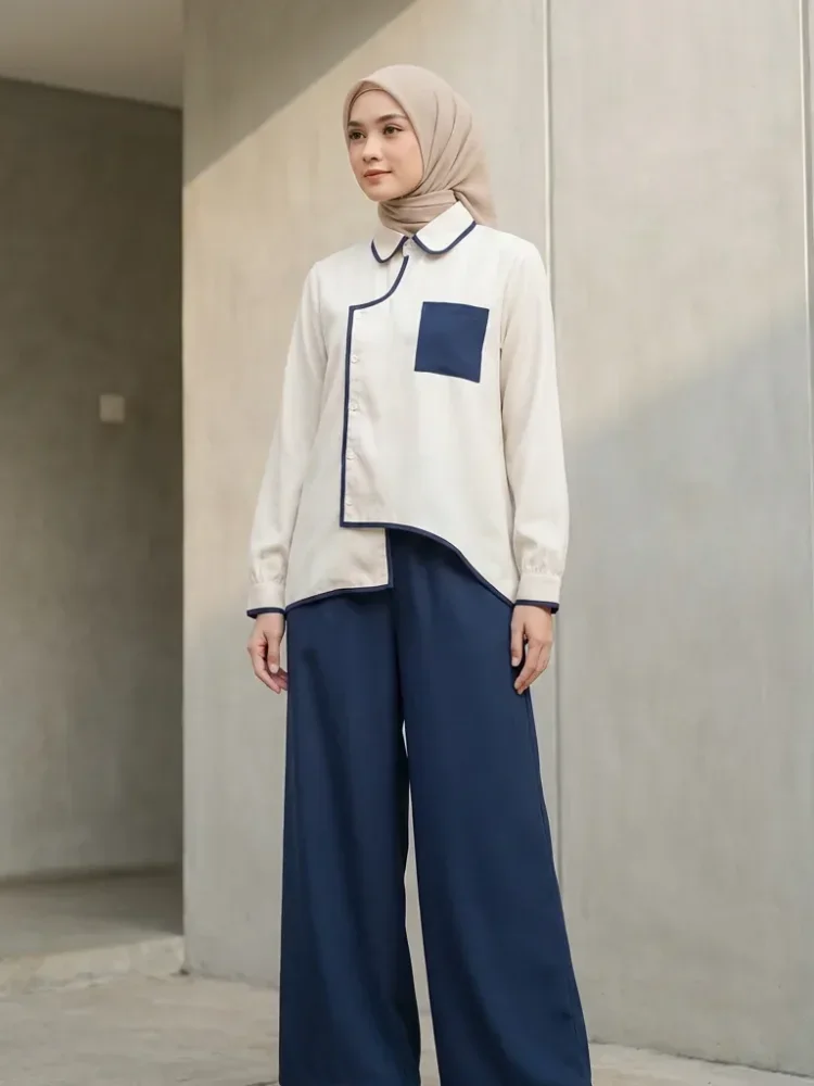 ASAYA Atasan lengan panjang warna kontras dengan kantong dan desain tepi tidak beraturan dipadukan dengan celana panjang longgar berwarna polos