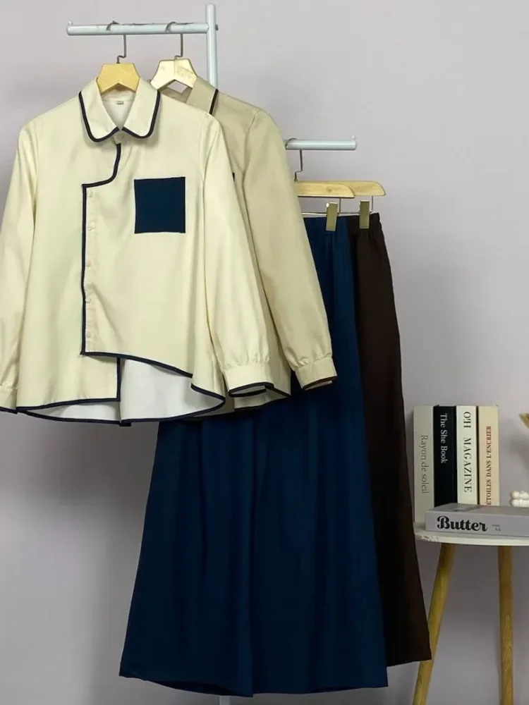 ASAYA Atasan lengan panjang warna kontras dengan kantong dan desain tepi tidak beraturan dipadukan dengan celana panjang longgar berwarna polos